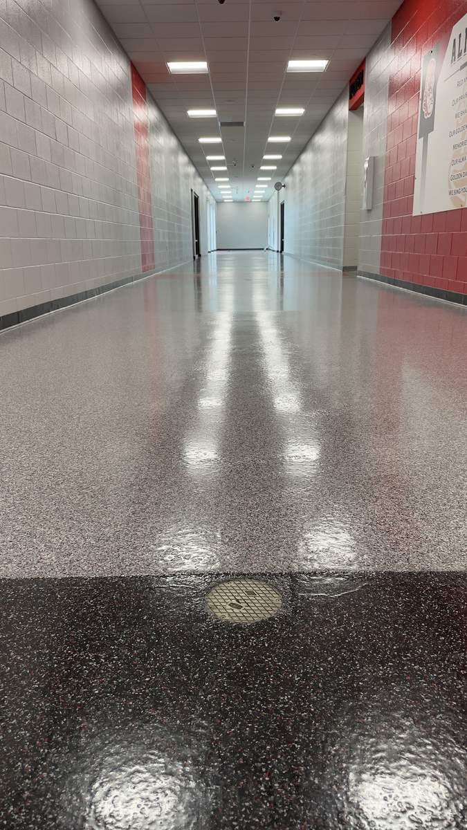 School corridor with a high-gloss resinous floor