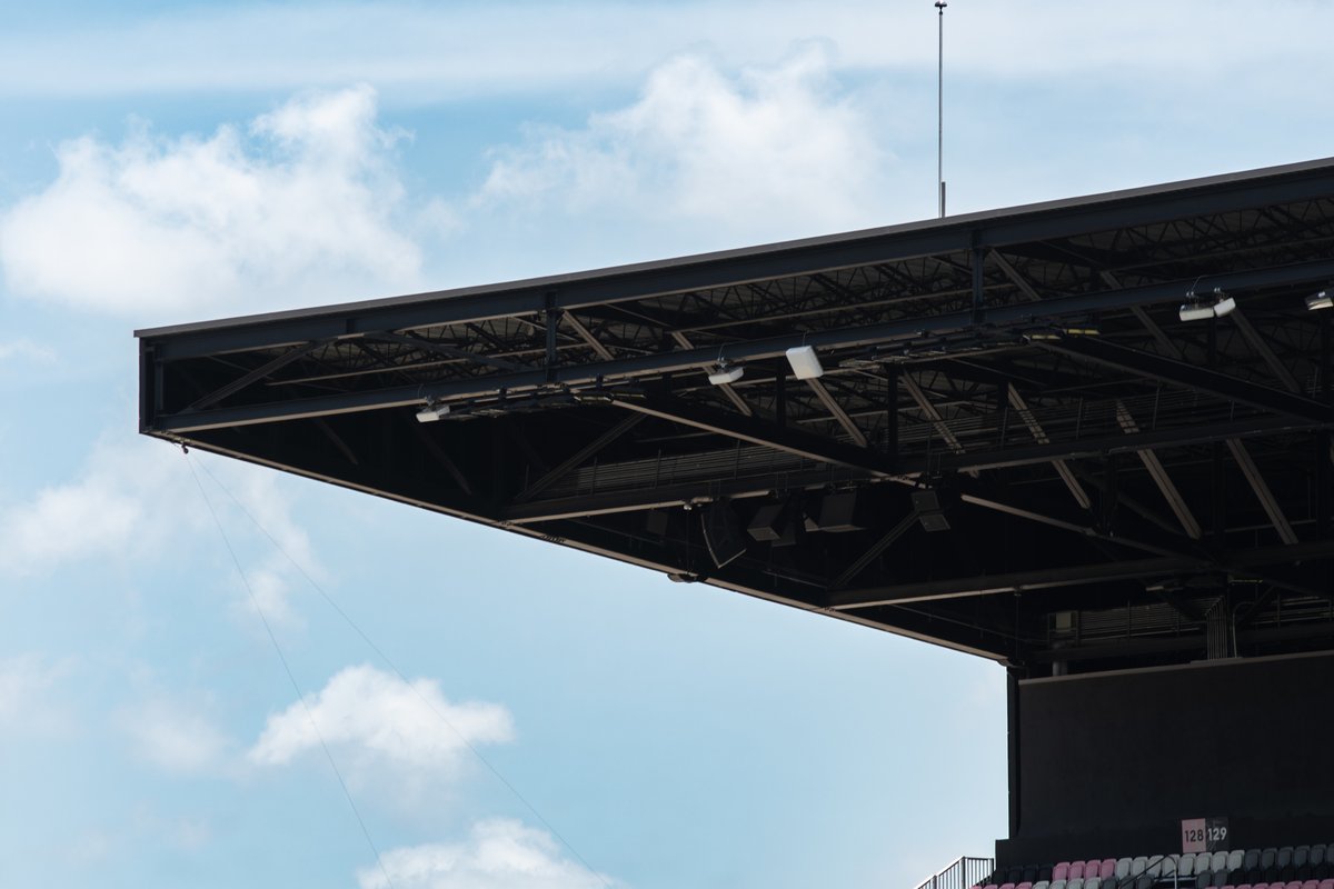 Stadium roof canopy steel against a blue sky